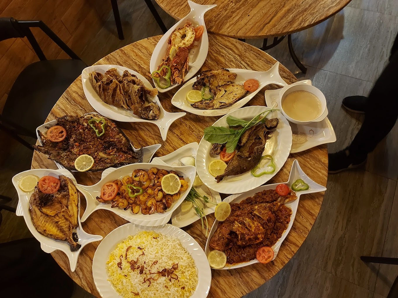 Shared Gulf-style dishes served at a table